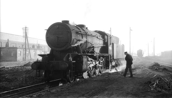 Woodford Austerity № 90486 Early Morning with a BR Standard 2-10-0 approaching in the distance.